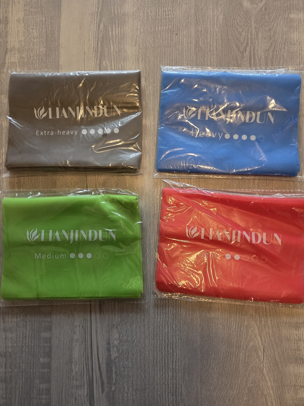 Resistance Band Set Of 4 with Multiple Strengths in Green, Red, Blue, Gray